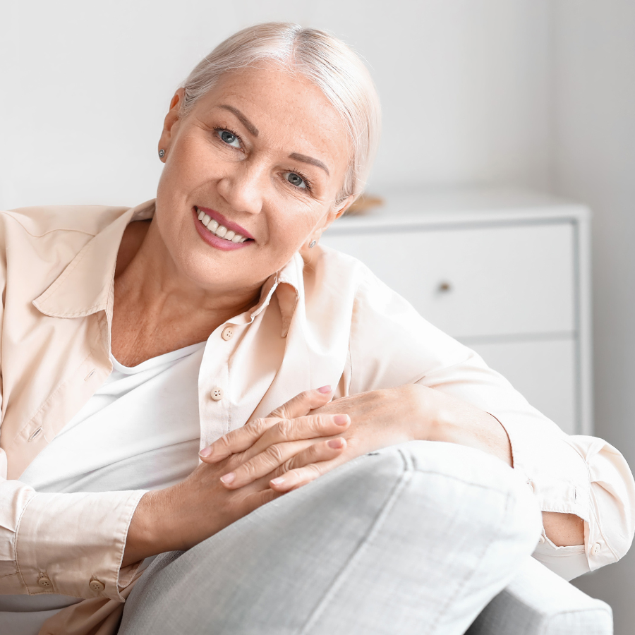 Mature woman with glowing skin following menopause skin care routine